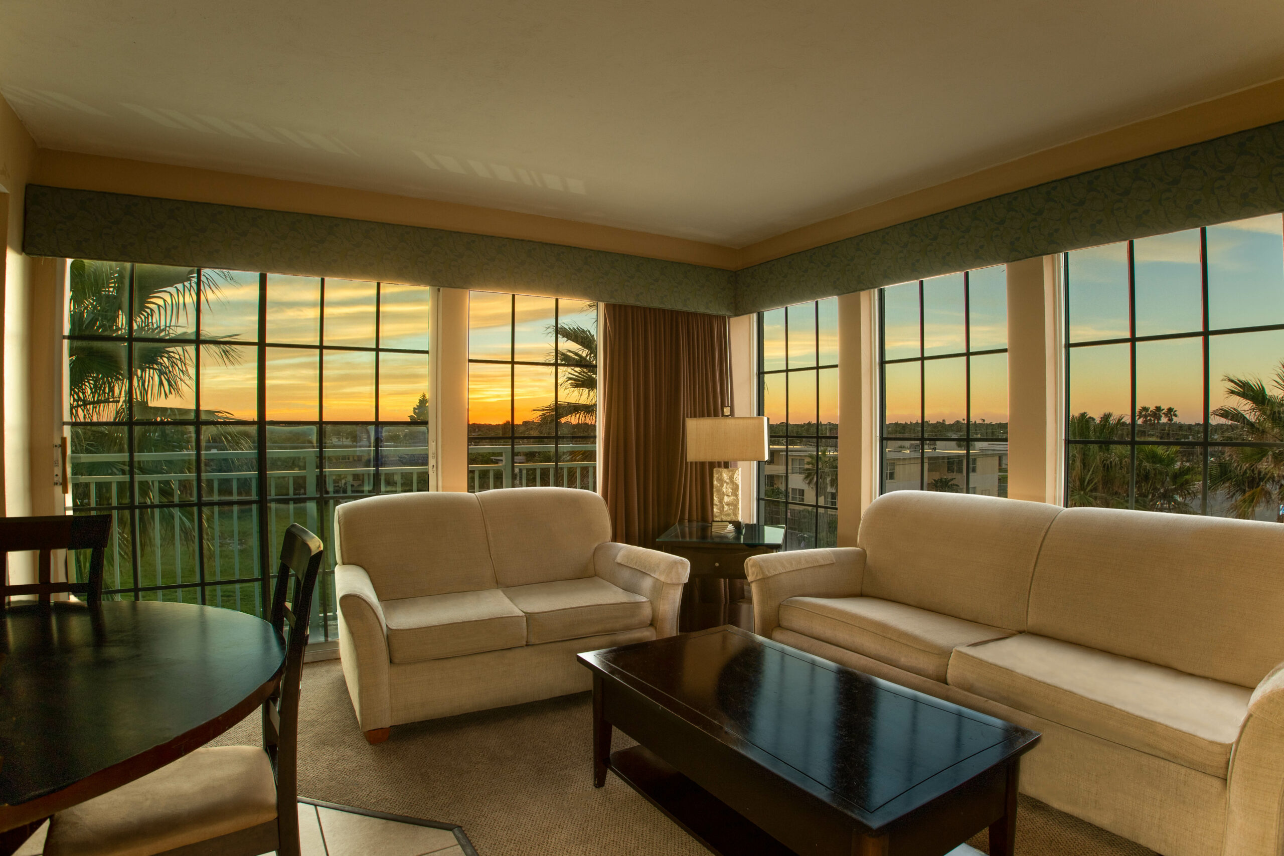 An elegant living room with a view of the sunset